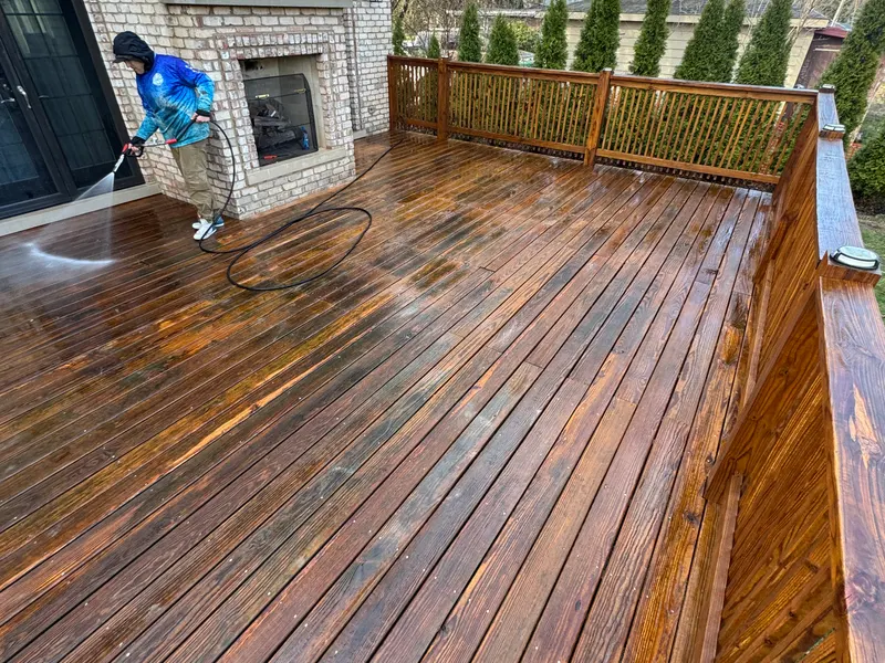 Our crew washing a wood deck