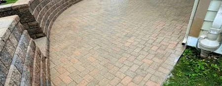 A paver patio cleaned by our crew, after