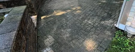 A paver patio cleaned by our crew, before